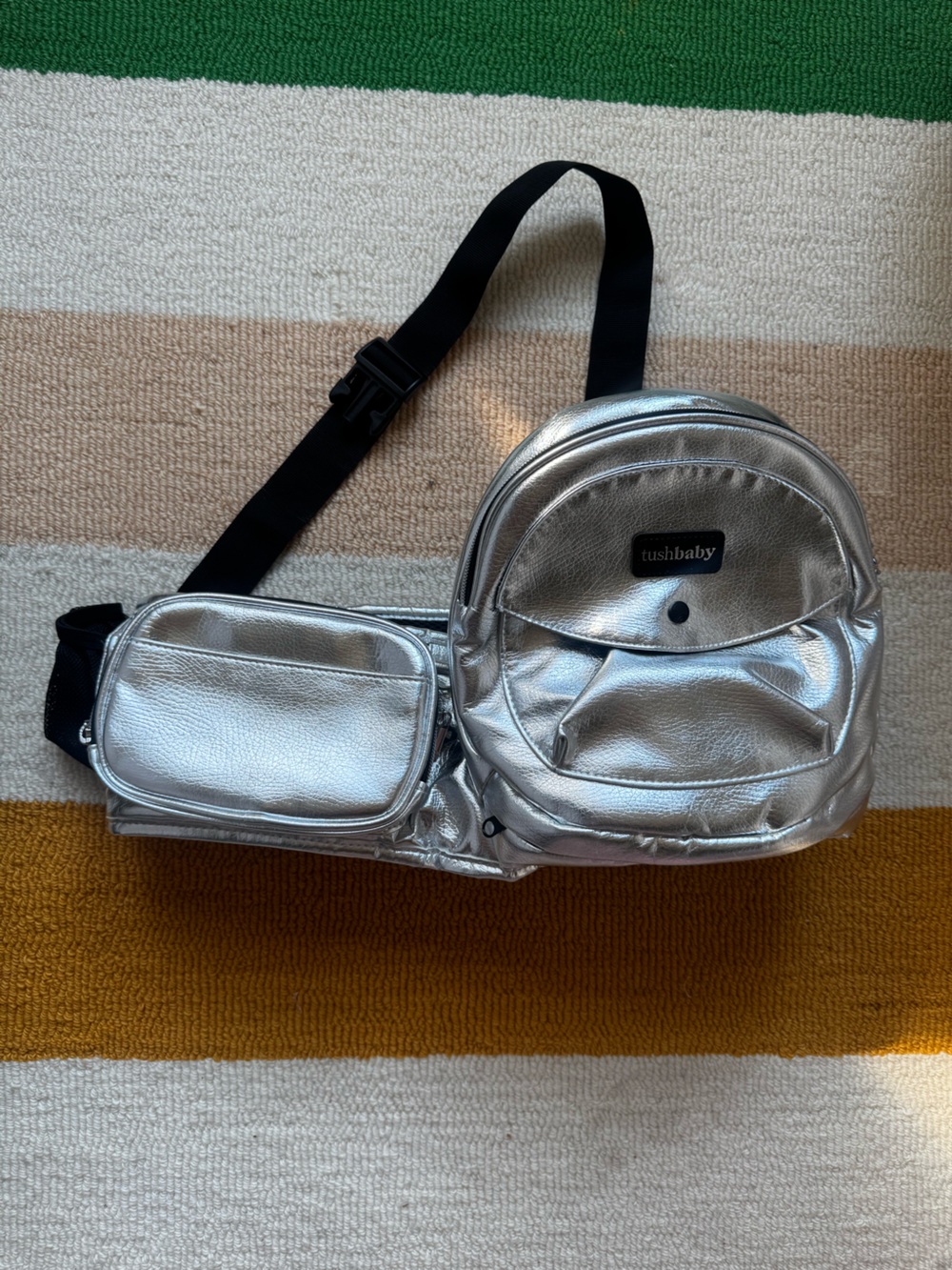 tushbaby carrier , brand new with box, silver
